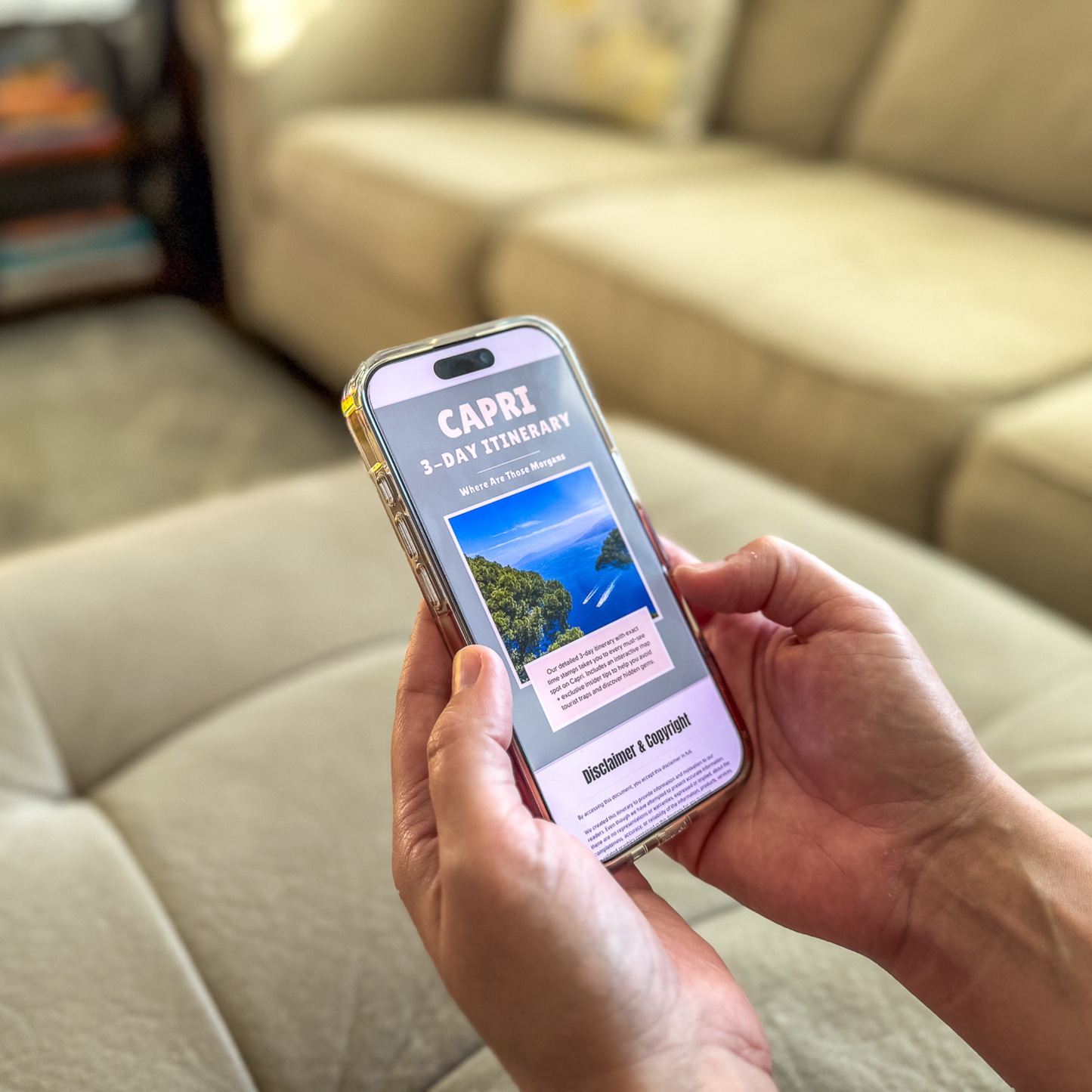 Person holding a smartphone with a 'Capri' itinerary displayed, sitting on a beige couch.